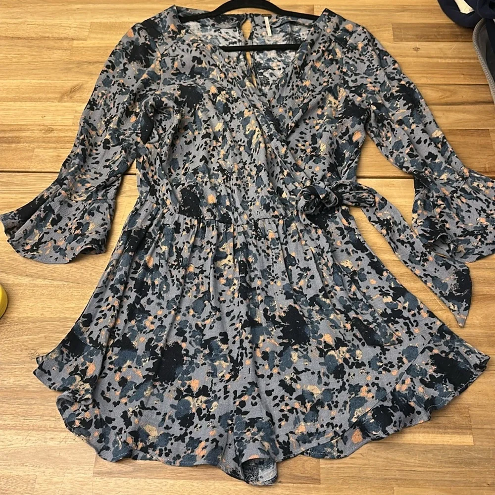 FREE PEOPLE “all the right ruffles” romper